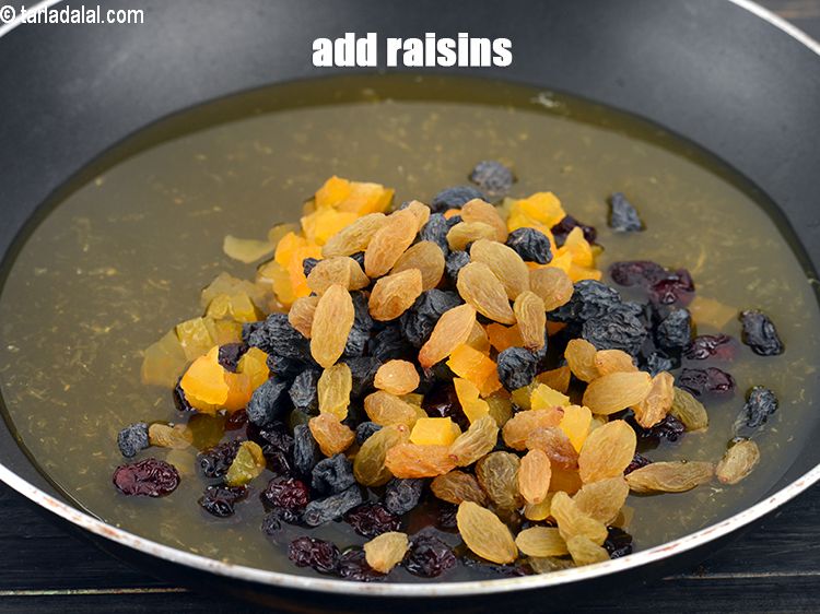 Step 9 – Add 2 tbsp <a href="https://www.tarladalal.com/glossary-raisins-kishmish-kismis-597i">raisins (kismis)</a>.&nbsp;