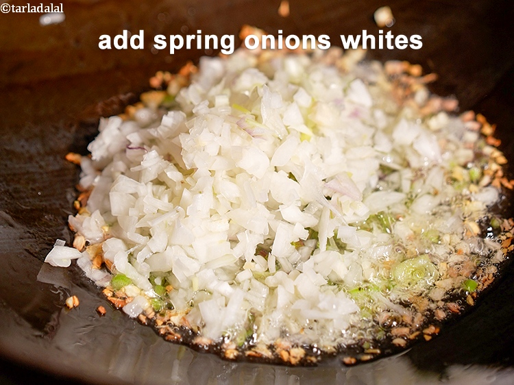 Step 11 – Add &frac14; cup finely <a href="https://www.tarladalal.com/glossary-chopped-spring-onion-whites-815i">chopped spring onions whites</a>.&nbsp;Spring onion whites have a mild and …