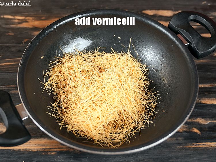 Step 8 – Add 1 cup&nbsp;<a href="https://www.tarladalal.com/glossary-crushed-vermicelli-2569i">crushed vermicelli (sevaiyan)</a>.