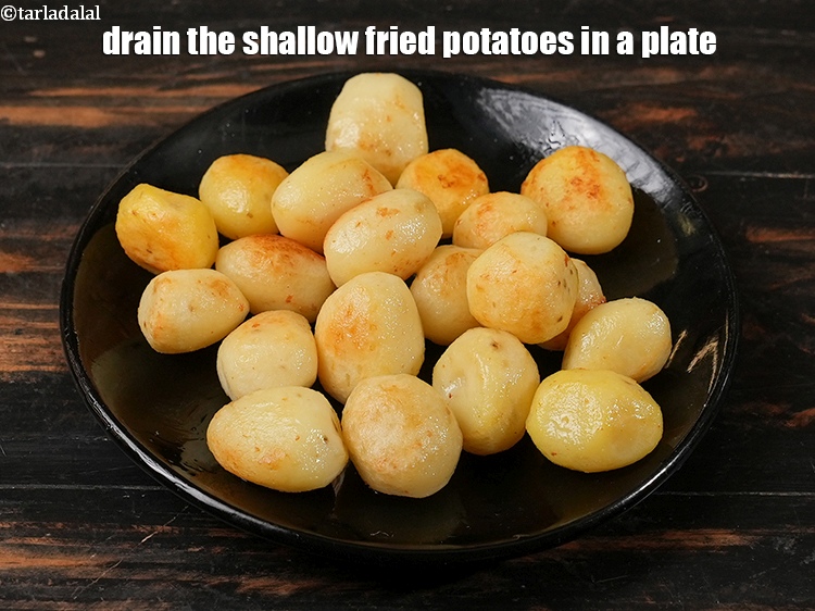 Step 8 – Drain the shallow fried potatoes in a plate and keep aside.