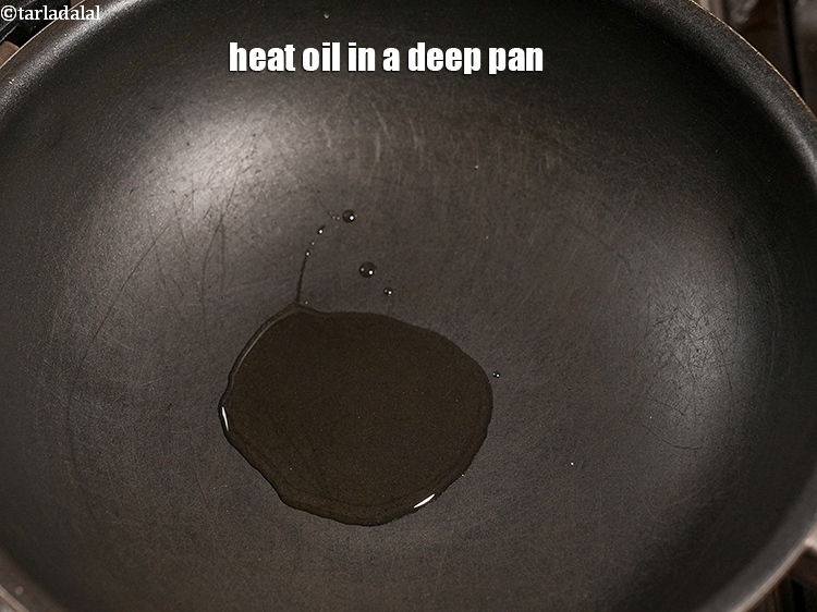 Step 8 – Heat 2 tsp oil in a deep pan.