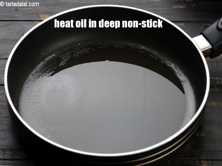 Step 9 – To make <strong>railway patties</strong>, heat the 1 tbsp oil in a deep non-stick.