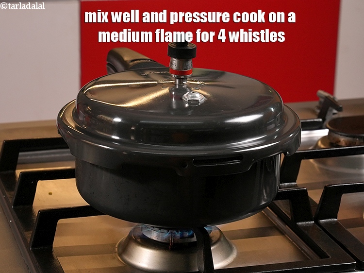 Step 8 – Mix well and pressure cook on a medium flame for 4 whistles.&nbsp;