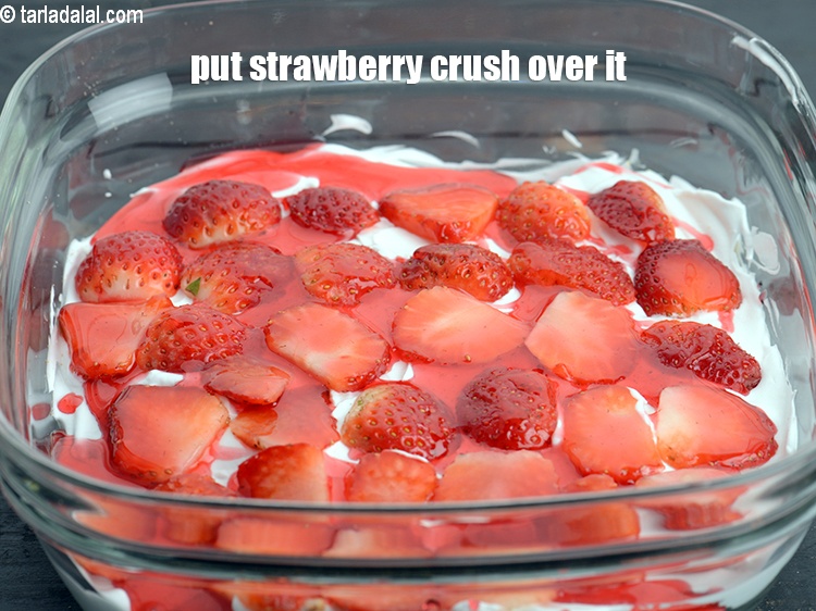 Step 8 – Put 1 tbsp <a href="https://www.tarladalal.com/glossary-strawberry-crush-strawberry-syrup-379i">strawberry crush</a> evenly over it.