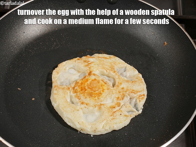 Step 8 – Turnover the egg with the help of a wooden spatula and cook on a medium …