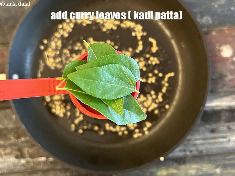 Step 15 – Add&nbsp;<meta charset="UTF-8" />6&nbsp;<a href="glossary-curry-leaves-kadi-patta-kadipatta-388i">curry leaves (kadi patta)</a>.