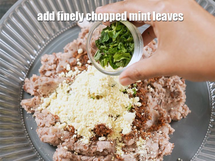 Step 12 – Add 1 tbsp finely <a href="https://www.tarladalal.com/glossary-chopped-mint-788i">chopped mint leaves (phudina)</a>.