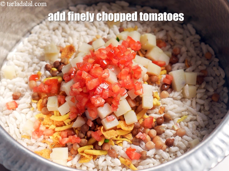 Step 9 – Add &frac12; cup finely <a href="https://www.tarladalal.com/glossary-chopped-tomatoes-779i">chopped tomatoes</a>.