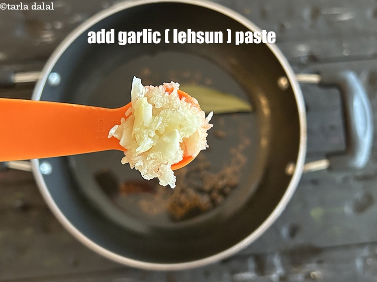 Step 15 – Add&nbsp;<meta charset="UTF-8" />1 tsp&nbsp;<a href="glossary-garlic-paste-lehsun-ki-paste-lahsun-ki-paste-350i">garlic (lehsun) paste</a>.