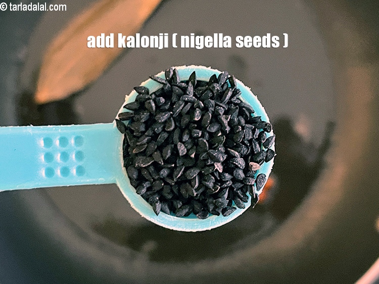 Step 8 – Add&nbsp;<meta charset="UTF-8" />1/2 tsp&nbsp;<a href="glossary-nigella-seeds-kalonji-onion-seeds-552i">nigella seeds (kalonji)</a>.