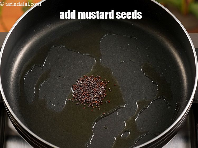 Step 8 – Add &frac12; tsp <a href="https://www.tarladalal.com/glossary-mustard-seeds-sarson-rai-sarson-ke-beej-525i">mustard seeds ( rai / sarson)</a>.