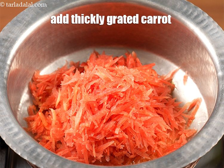 Step 8 – Add 4 cups thickly <a href="https://www.tarladalal.com/glossary-grated-carrot-816i">grated carrot</a>.