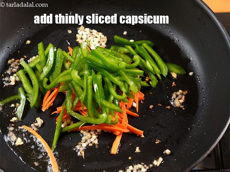 Step 9 – Add 1/2 cup thinly <a href="https://www.tarladalal.com/glossary-sliced-capsicum-165i">sliced capsicum</a>.
