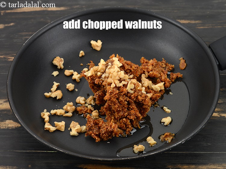 Step 8 – Add 2 tbsp <a href="https://www.tarladalal.com/glossary-chopped-walnuts-785i">chopped walnuts (akhrot)</a>.