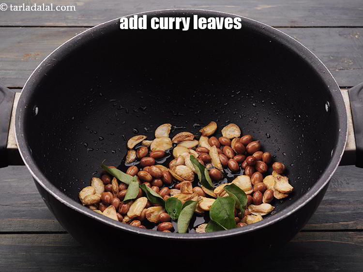 Step 8 – Add the <a href="https://www.tarladalal.com/glossary-curry-leaves-kadi-patta-kadipatta-388i" target="_blank">curry leaves</a>.