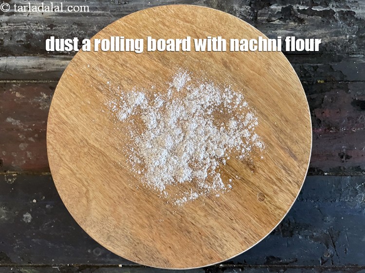 Step 9 – Dust a rolling board with nachni flour.