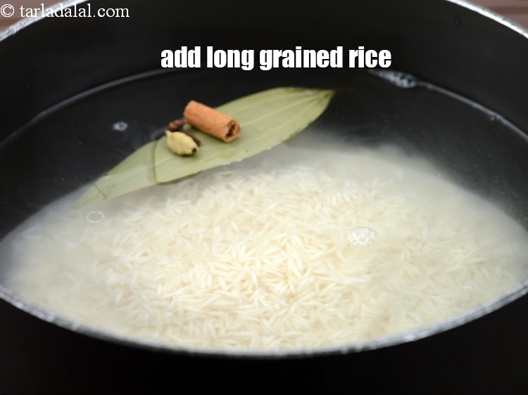 Step 10 – Add 1 1/2 cups&nbsp;<a href="https://www.tarladalal.com/glossary-long-grain-rice-basmati-chawal-basmati-rice-535i">long grained rice (basmati)</a>&nbsp;, soaked and drained.