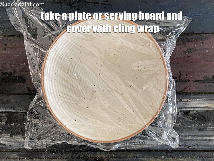 Step 11 – Take a plate and cover it with cling wrap.