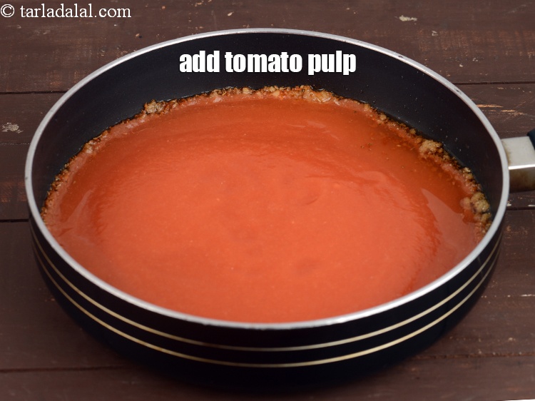 Step 14 – Add&nbsp;2 cups&nbsp;fresh&nbsp;<a href="https://www.tarladalal.com/glossary-tomato-pulp-tamatar-ka-pulp-1039i">tomato pulp</a>.