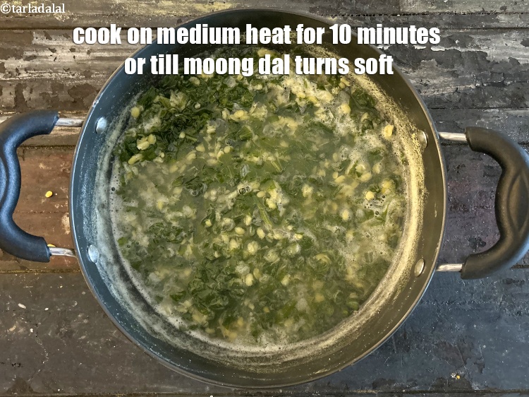 Step 10 – Cook on a medium flame for <strong>10 minutes</strong> or till moong dal turns soft.