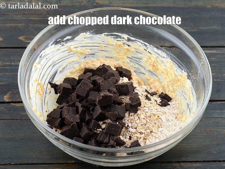 Step 8 – Add 1/2 cup&nbsp;<a href="https://www.tarladalal.com/glossary-chopped-dark-chocolate-792i">chopped dark chocolate</a>.<br /> .