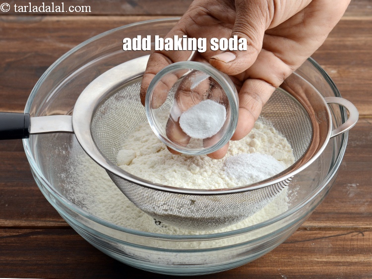 Step 10 – Add &frac14; tsp <a href="https://www.tarladalal.com/glossary-baking-soda-soda-bi-carb-615i">baking soda</a>.