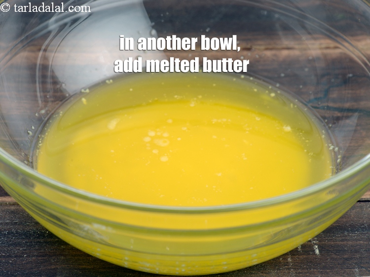 Step 8 – In another deep bowl, add &frac12; cup <a href="https://www.tarladalal.com/glossary-melted-butter-1941i">melted butter</a>.