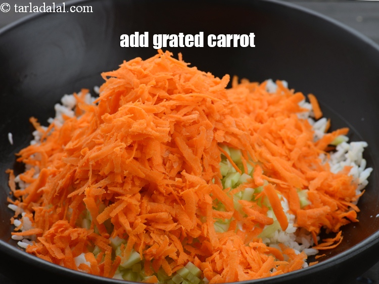 Step 9 – Add 1 cup&nbsp;<a href="https://www.tarladalal.com/glossary-grated-carrot-816i">grated carrot</a>