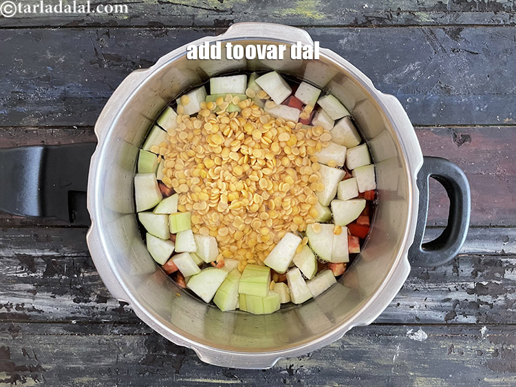 Step 19 – Add the washed and soaked&nbsp;<meta charset="UTF-8" />3/4 cup&nbsp;<a href="glossary-toovar-dal-arhar-dal-toor-dal-split-pigeon-peas-tur-dal-955i">toovar (arhar) dal</a>.&nbsp;See above on how to …