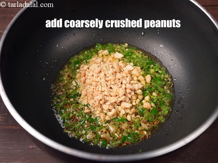 Step 9 – Add 2 tbsp coarsely <a href="https://www.tarladalal.com/glossary-crushed-raw-peanuts-917i">crushed peanuts</a>.