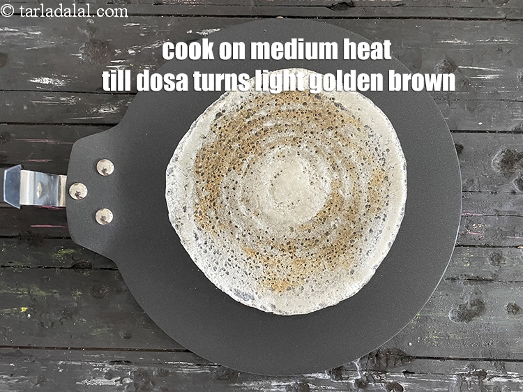 Step 70 – Cook on medium flame till the dosa turns light brown in colour.
