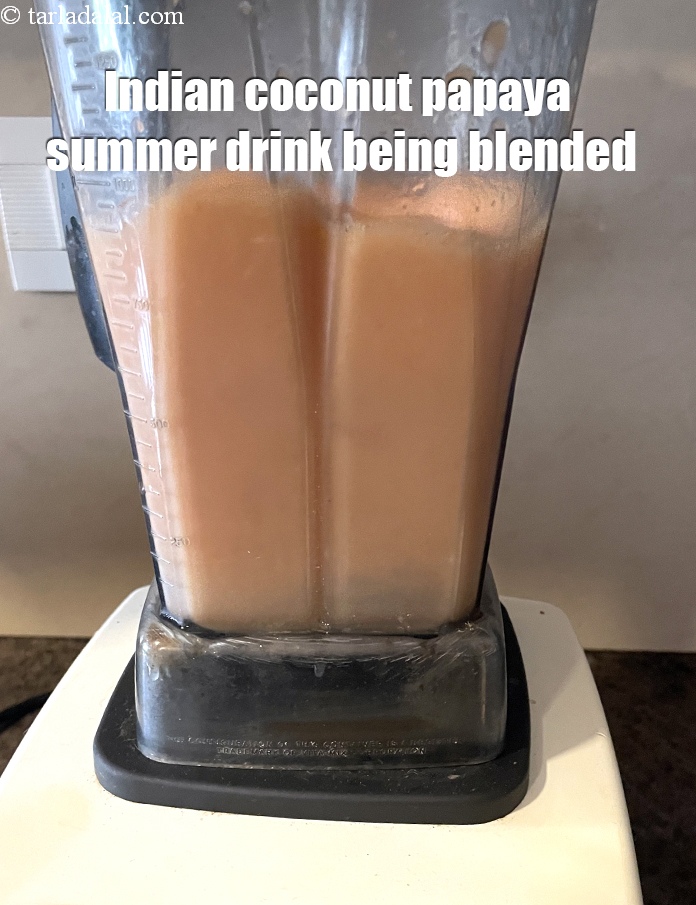 Step 13 – <meta charset="UTF-8" /><strong>Indian coconut papaya summer drink&nbsp;</strong>being blended.