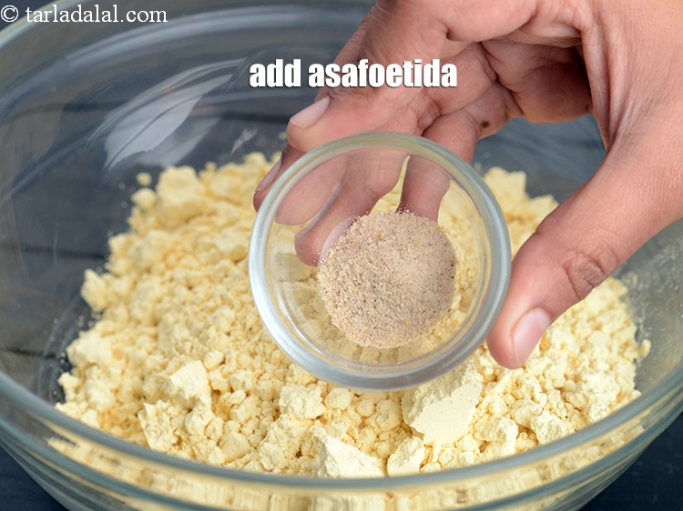 Step 9 – Add &frac12; tsp <a href="https://www.tarladalal.com/glossary-asafoetida-hing-113i">asafoetida (hing)</a>.