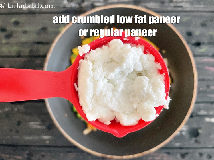 Step 16 – Add&nbsp;<meta charset="UTF-8" />1/4 cup&nbsp;<a href="glossary-crumbled-low-fat-paneer-1117i">crumbled low fat paneer (cottage cheese)</a>.