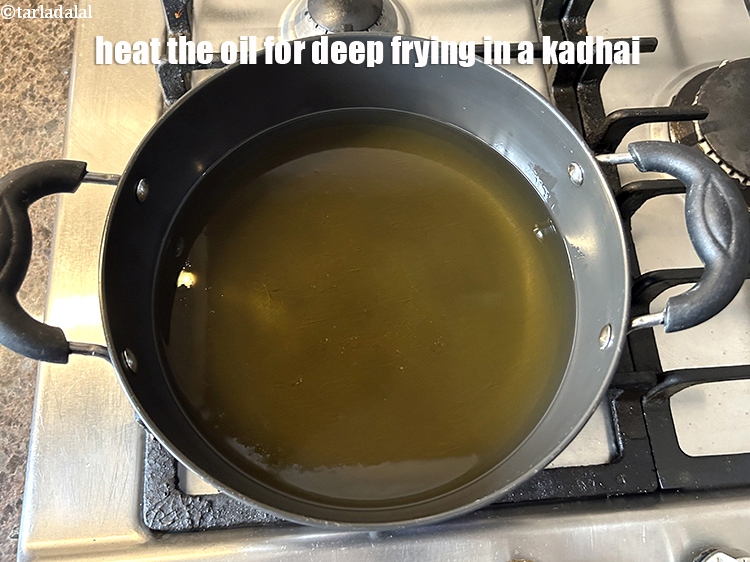 Step 8 – Heat the oil for deep-frying in a kadhai.