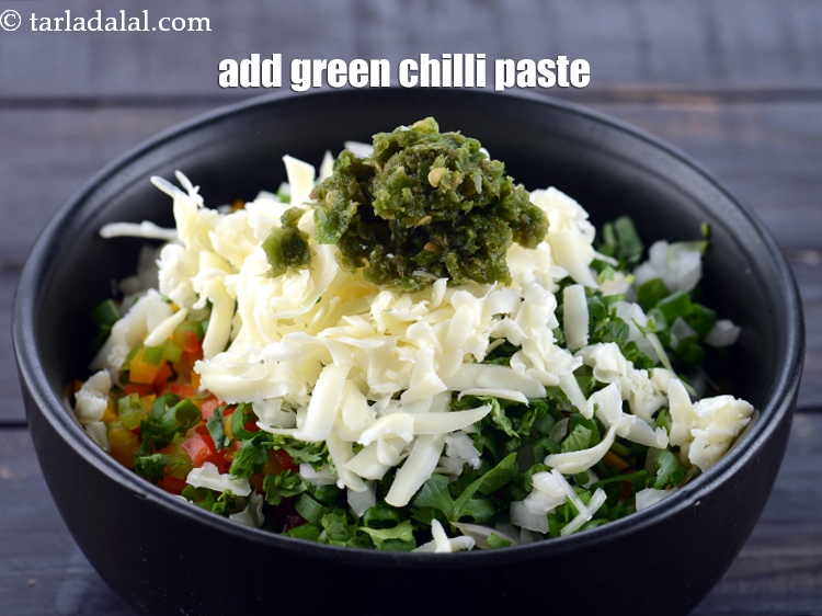 Step 8 – Add 1/2 tsp <a href="https://www.tarladalal.com/glossary-green-chilli-paste-hari-mirch-ki-paste-mirchi-paste-333i">green chilli paste</a>.