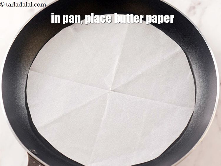 Step 8 – In a non-stick pan, place the butter paper at the bottom of the pan.