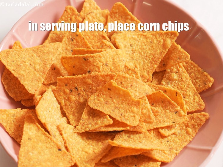 Step 24 – In a serving plate, place 1 cup <a href="https://www.tarladalal.com/glossary-corn-chips-1029i">corn chips</a>.&nbsp;