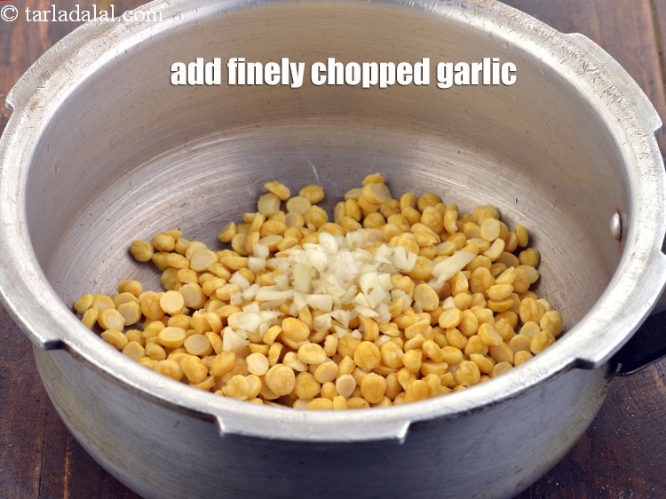 Step 8 – Add 2 tsp finely <a href="https://www.tarladalal.com/glossary-chopped-garlic-790i">chopped garlic (lehsun)</a>.