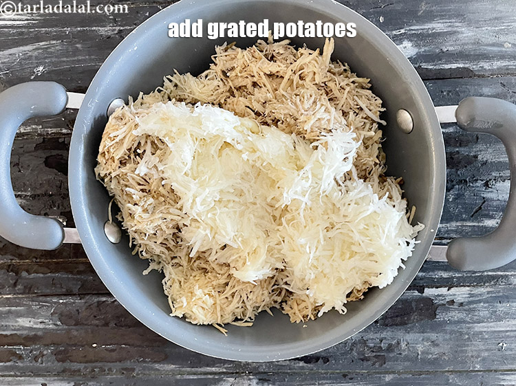 Step 14 – Add&nbsp;<meta charset="UTF-8" />1 cup&nbsp;peeled and&nbsp;<a href="glossary-grated-potatoes-867i">grated potatoes</a>.
