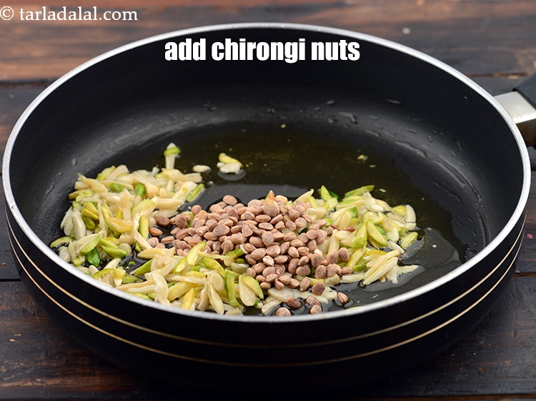 Step 8 – Add 1 tbsp&nbsp;<a href="https://www.tarladalal.com/glossary-chirongi-nuts-charoli-piyal-seeds-305i">chirongi nuts (charoli)</a>