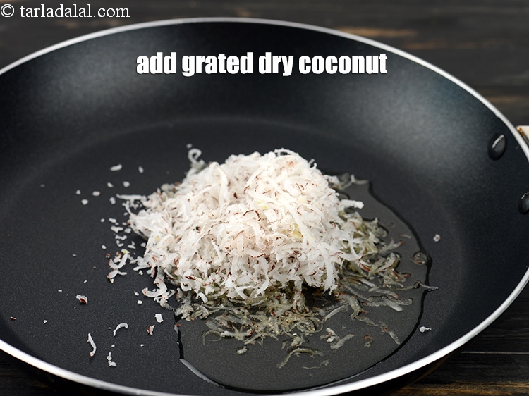 Step 8 – Add 1/2 cup&nbsp;<a href="https://www.tarladalal.com/glossary-grated-dry-coconut-2272i">grated dry coconut (kopra)</a>.&nbsp;