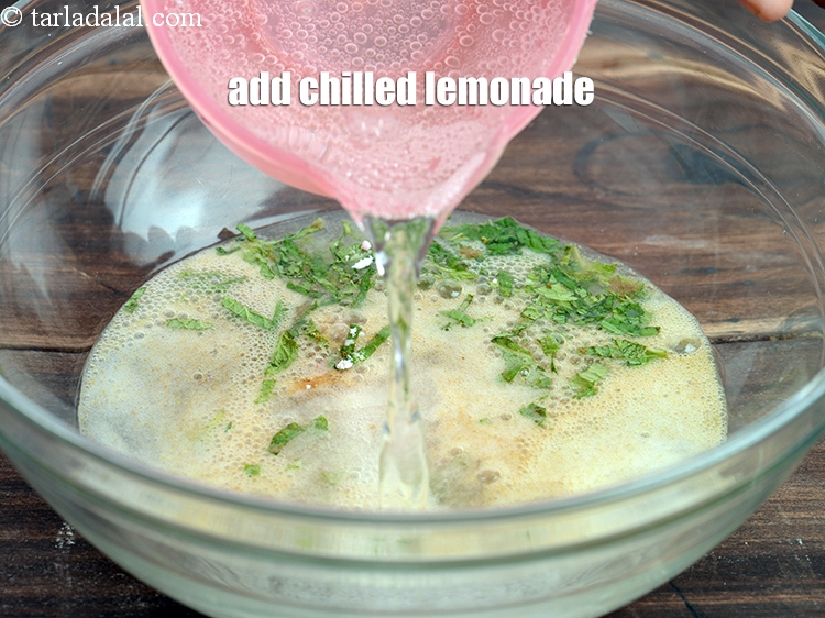 Step 8 – Add 2 cups chilled <a href="https://www.tarladalal.com/glossary-lemonade-lemon-drink-1008i">lemonade</a>.
