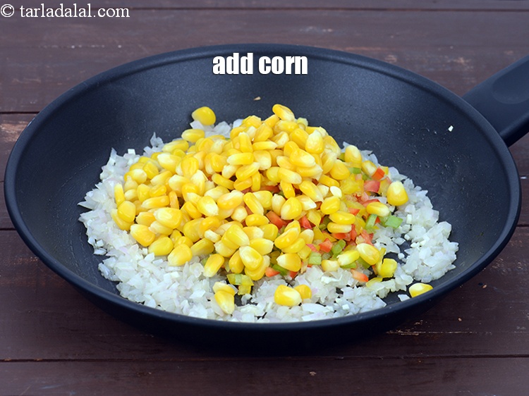 Step 8 – Add 1/2 cup&nbsp;<a href="https://tarladalal.com/glossary-boiled-sweet-corn-kernels-153i">boiled sweet corn kernels (makai ke dane)</a>.&nbsp;