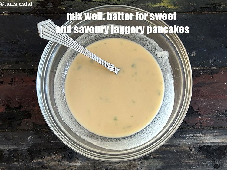 Step 8 – Mix well.&nbsp;Batter for seet and savoury jaggery pancakes.