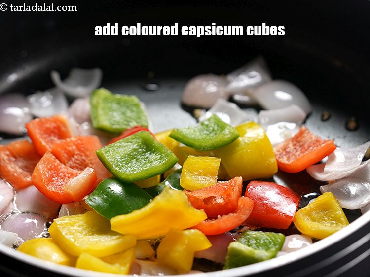 Step 16 – Add 3/4 cup&nbsp;coloured&nbsp;<a href="https://www.tarladalal.com/glossary-capsicum-cubes-170i">capsicum cubes</a>.&nbsp;