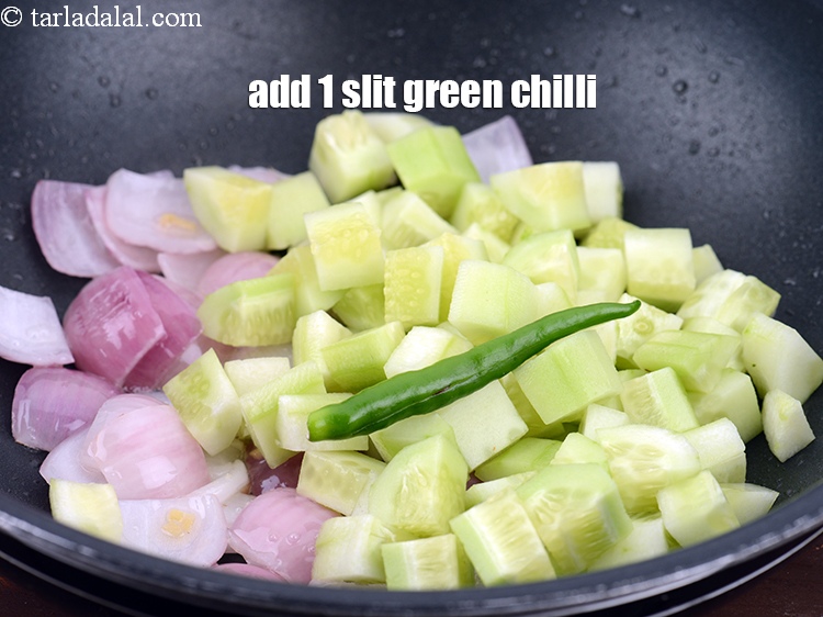 Step 8 – Add 1 <a href="https://www.tarladalal.com/glossary-slit-green-chillies-1856i">slit green chilli</a>.