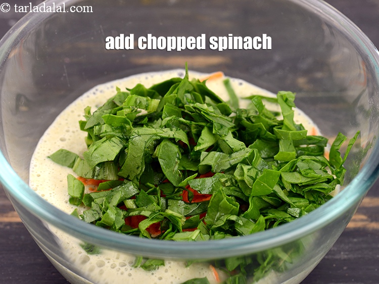 Step 8 – Add &frac14; cup <a href="https://www.tarladalal.com/glossary-chopped-spinach-780i">chopped spinach (palak)</a>.