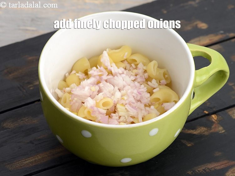 Step 8 – Now add 1 tbsp finely <a href="https://www.tarladalal.com/glossary-chopped-onions-722i">chopped onions</a>.
