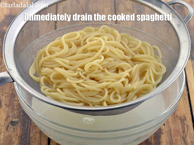 Step 8 – Immediately drain the cooked spaghetti into a sieve or colander.
